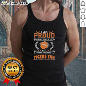 Woman wearing a Clemson Tigers fan tank top, proudly showcasing her love for the team and school spirit.