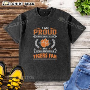 Alt Text: Clemson Tigers fan wearing a washed t-shirt with 'I am proud of many things but nothing beats being a Clemson Tigers fan.'