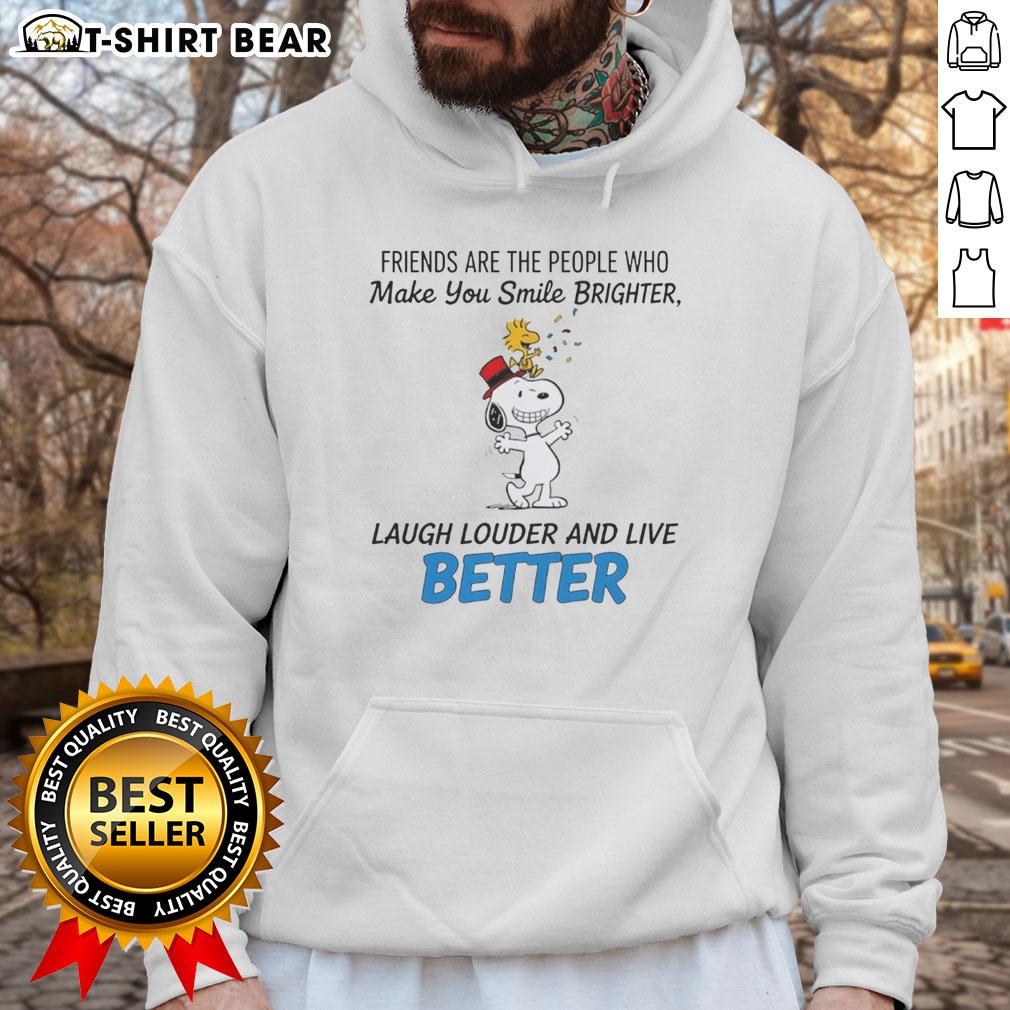 Alt Text: Cozy hoodie featuring Snoopy and friends with the quote about smiling brighter, laughing louder, and living better.