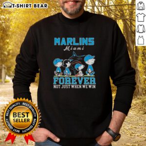 Alt Text: Cute Snoopy and Charlie Brown sweatshirt celebrating Miami Marlins baseball, perfect for fans year-round.