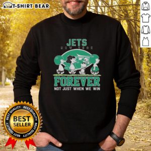 Alt Text: Cute Snoopy and Charlie Brown in New York Jets sweatshirt, showcasing Forever Not Just When We Win slogan.
