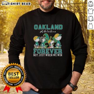 Alt Text: Cute Snoopy and Charlie Brown on an Oakland Athletics baseball sweatshirt saying Forever, Not Just When We Win.