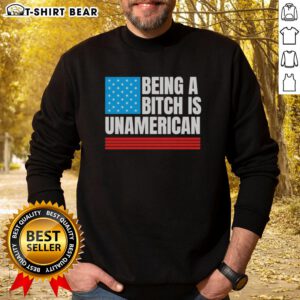 Alt Text: USA flag sweatshirt with the phrase 'Good Being a Bitch is Unamerican' promoting bold self-expression and patriotism.