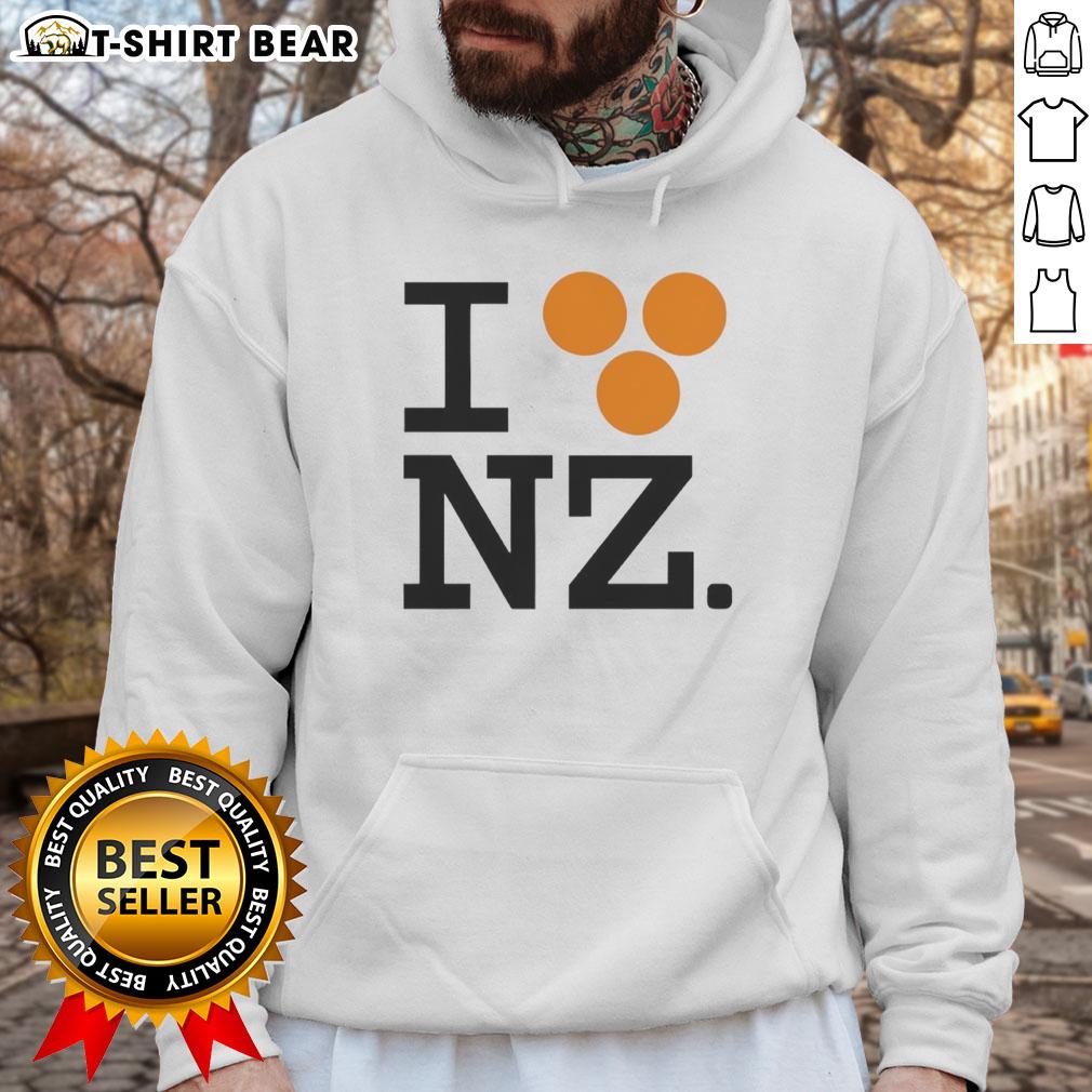 Orlando Bloom wearing a 'Good I Love NZ' hoodie, showcasing a stylish design perfect for fans of New Zealand.