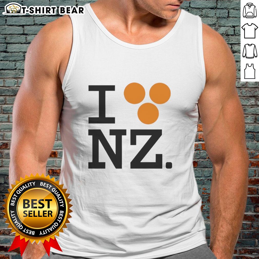Orlando Bloom wearing a 'Good I Love NZ' tank top, showcasing a stylish and casual look perfect for summer vibes.