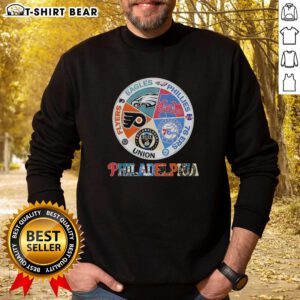 Cozy sweatshirt featuring logos of Philadelphia teams: Flyers, Eagles, Phillies, 76ers, and Union for fans.