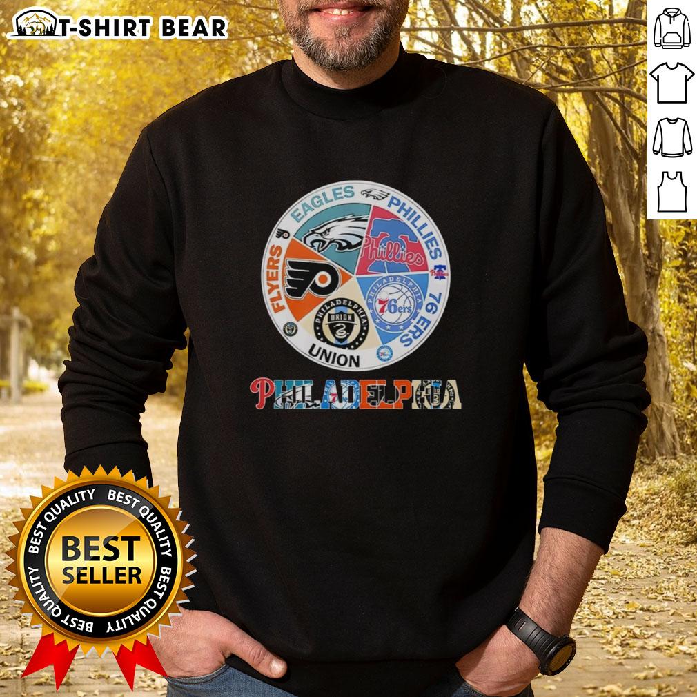Cozy sweatshirt featuring logos of Philadelphia teams: Flyers, Eagles, Phillies, 76ers, and Union for fans.