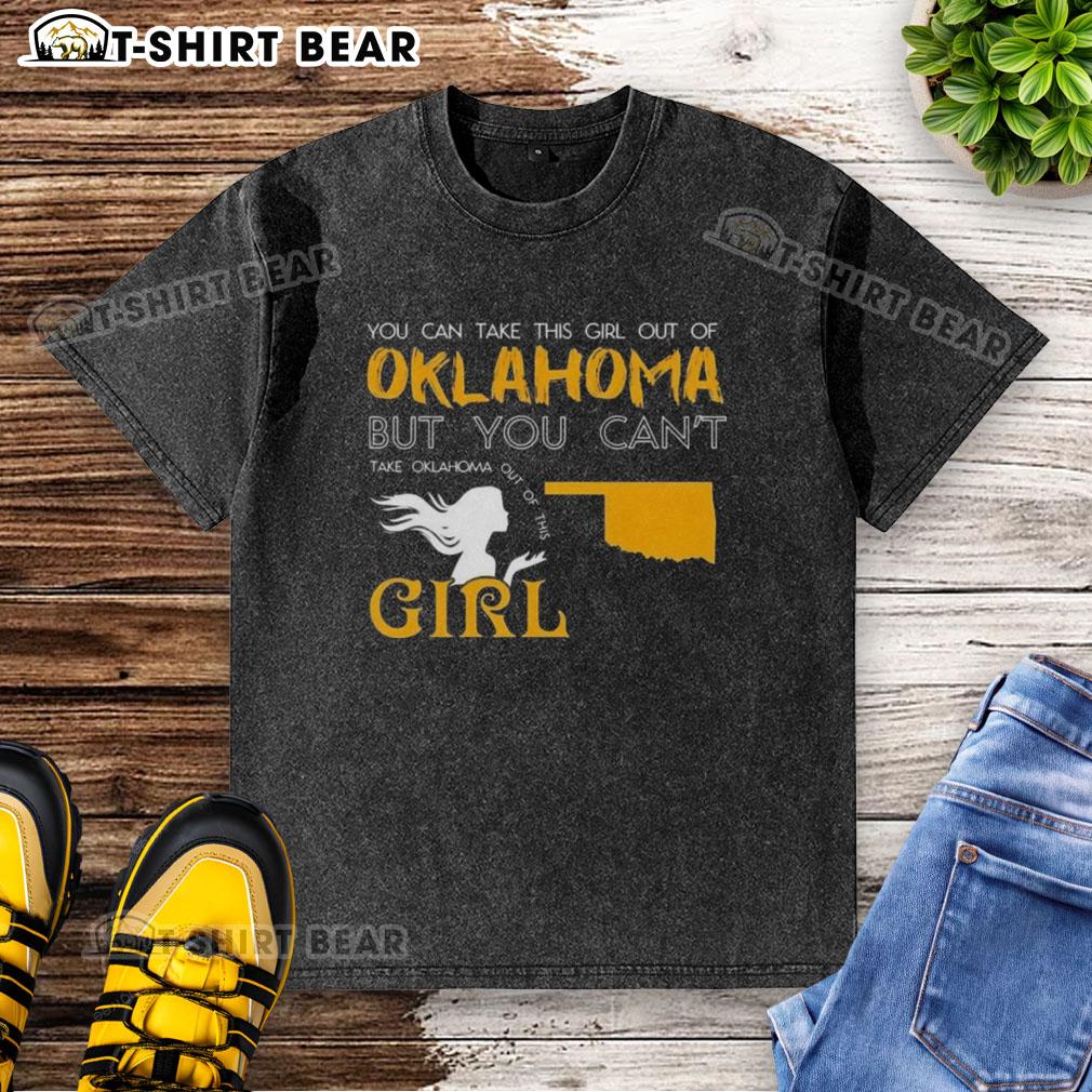 Girl wearing a 'Good You Can Take This Girl Out Of Oklahoma' washed t-shirt, showcasing Oklahoma pride and style.