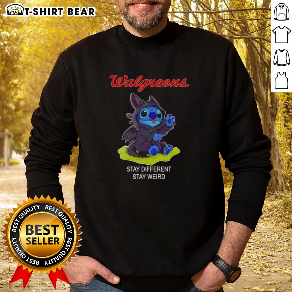 Happy Stitch Cosplay wearing Toothless X Walgreens sweatshirt: 'Stay Different, Stay Weird' design in vibrant colors.