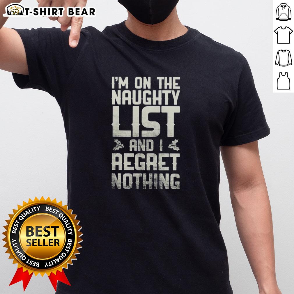 Alt Text: Retro T-shirt featuring Hot I'm On The Naughty List And I Regret Nothing slogan in festive colors for holiday fun.