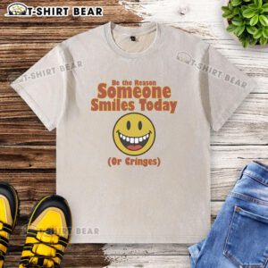 Nice Be The Reason Someone Smiles Today Or Cringes washed t-shirt in vibrant colors displayed on a rustic wooden background.