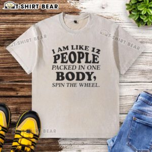 Colorful washed t-shirt featuring 'Nice, I am like 12 people packed in one body' spin the wheel quote design.