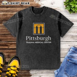 Alt Text: Nice Pittsburgh Trauma Medical Center logo on a washed t-shirt, showcasing a stylish design for medical professionals.