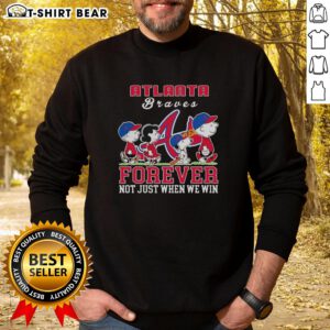 Snoopy Peanuts Atlanta Braves sweatshirt with 'Forever, Not Just When We Win' slogan, perfect for fans.