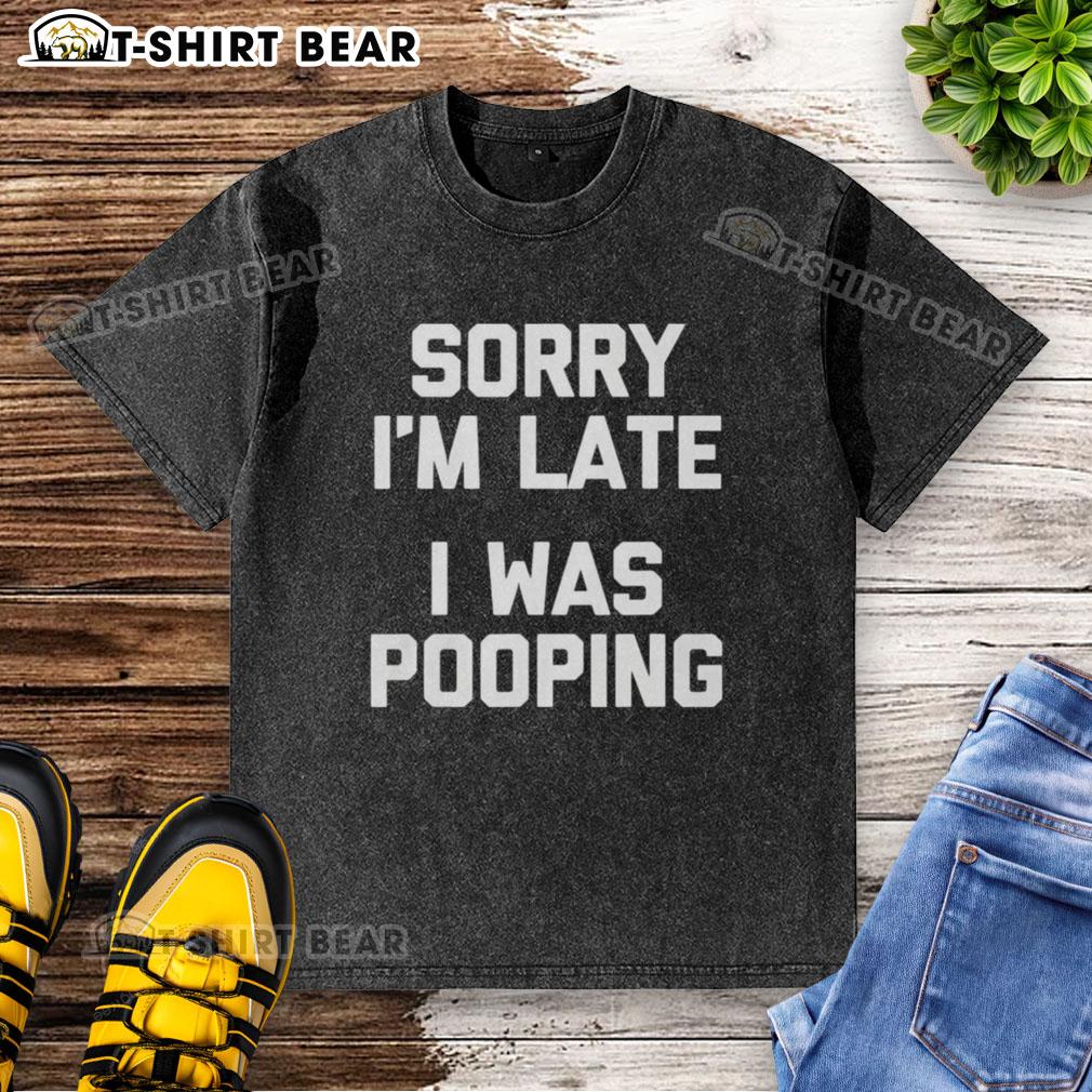 Funny 'Nice Sorry I'm Late I Was Pooping' washed t-shirt displayed on a hanger, perfect for humor lovers.