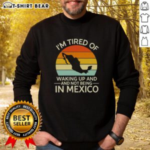 Cozy retro sweatshirt with 'I'm Tired of Waking Up and Not Being in Mexico' design, perfect for sunset vibes.