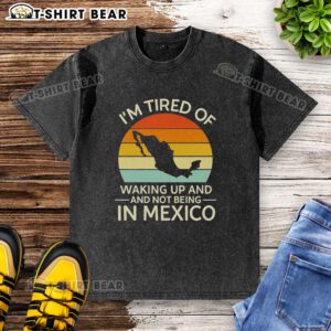 Retro washed t-shirt featuring 'I'm Tired of Waking Up and Not Being in Mexico' design, perfect for sunset lovers.