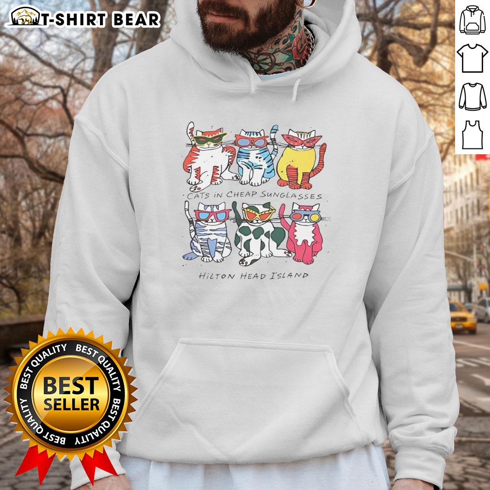 Official Justin in cheap sunglasses wearing a Hilton Head Island Cats graphic hoodie, showcasing a stylish beach look.