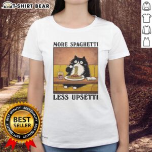 Black cat enjoying Italian food on a 'More Spaghetti Less Upsetti' ladies tee, perfect for cat lovers and foodies.