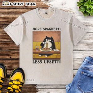 Alt Text: Black cat enjoying spaghetti on a washed t-shirt featuring More Spaghetti, Less Upsetti design.