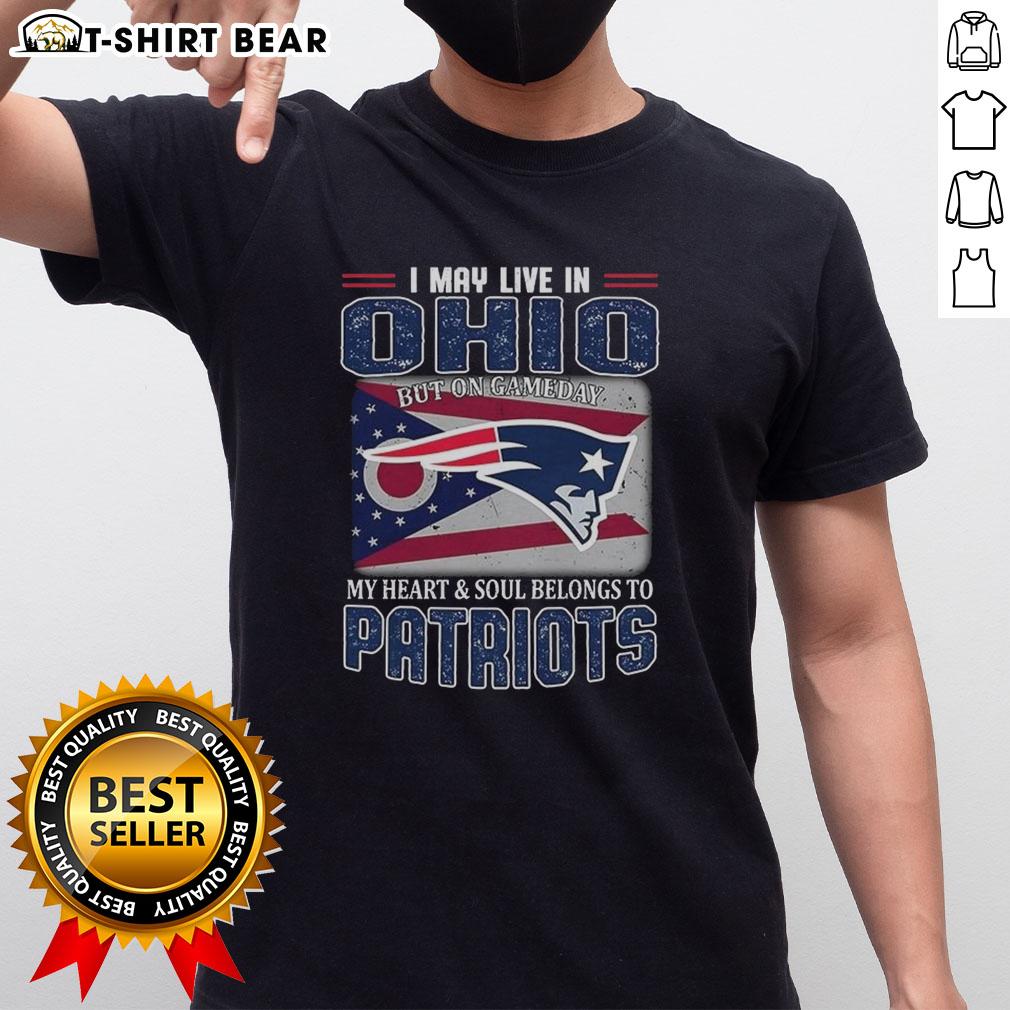 Ohio fan wearing New England Patriots flag t-shirt, showcasing team spirit on game day with pride and passion.