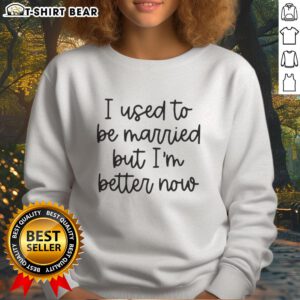Alt Text: Original 'I Used to Be Married But I'm Better Now' sweatshirt displayed on a hanger, perfect for casual wear.