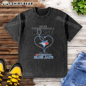 Alt Text: Original Toronto Blue Jays T-shirt featuring Never Underestimate a Nurse Who Understands Baseball slogan.
