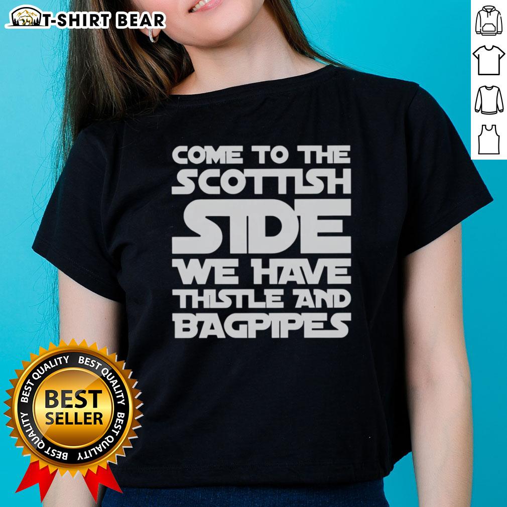 Scottish-themed ladies tee featuring thistle and bagpipes design. Perfect for celebrating Scottish heritage and culture.