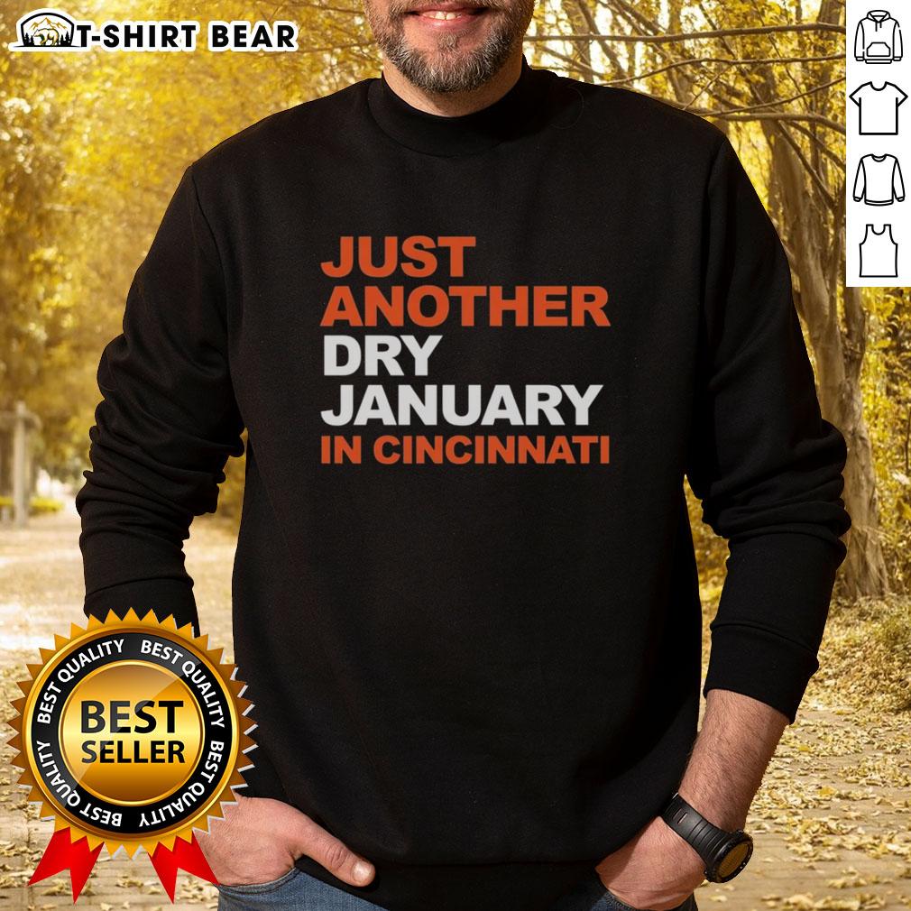 Cozy 'Just Another Dry January in Cincinnati' sweatshirt displayed on a wooden table, perfect for winter style.