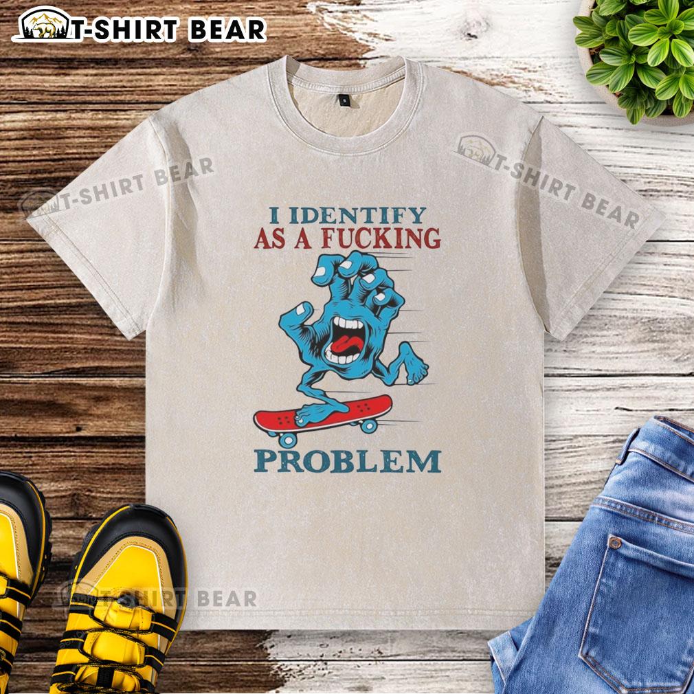 Top Screaming Hand graphic on a washed T-shirt with 'I Identify As A Fcking Problem' text for edgy streetwear style.