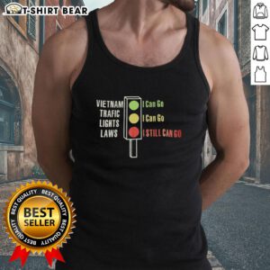 Alt Text: Top Vietnam traffic lights laws illustrated on a tank top: green means go, yellow means go, red means go.