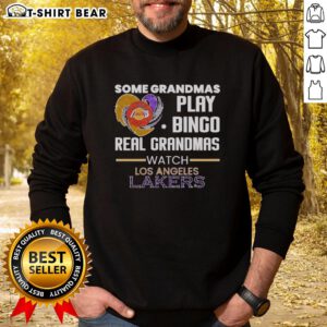 Awesome grandmas play bingo in Los Angeles Lakers sweatshirt, showcasing fun and team spirit in a vibrant setting.