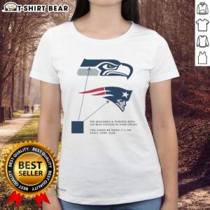 Seattle Seahawks and New England Patriots logos in blue on a ladies tee, showcasing team spirit and style.
