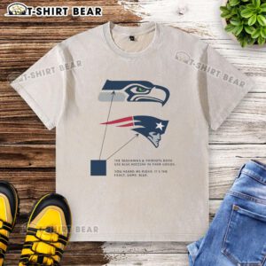 Blue washed T-shirt featuring logos of the Seattle Seahawks and New England Patriots, showcasing their shared color.