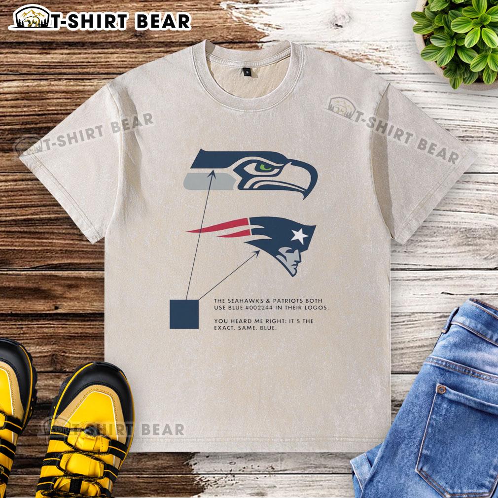 Blue washed T-shirt featuring logos of the Seattle Seahawks and New England Patriots, showcasing their shared color.