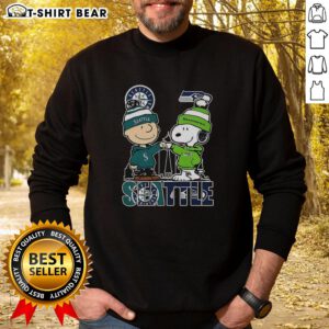 Nice Seattle Washington sweatshirt featuring Charlie Brown and Snoopy with Seattle Seahawks logo, perfect for fans.