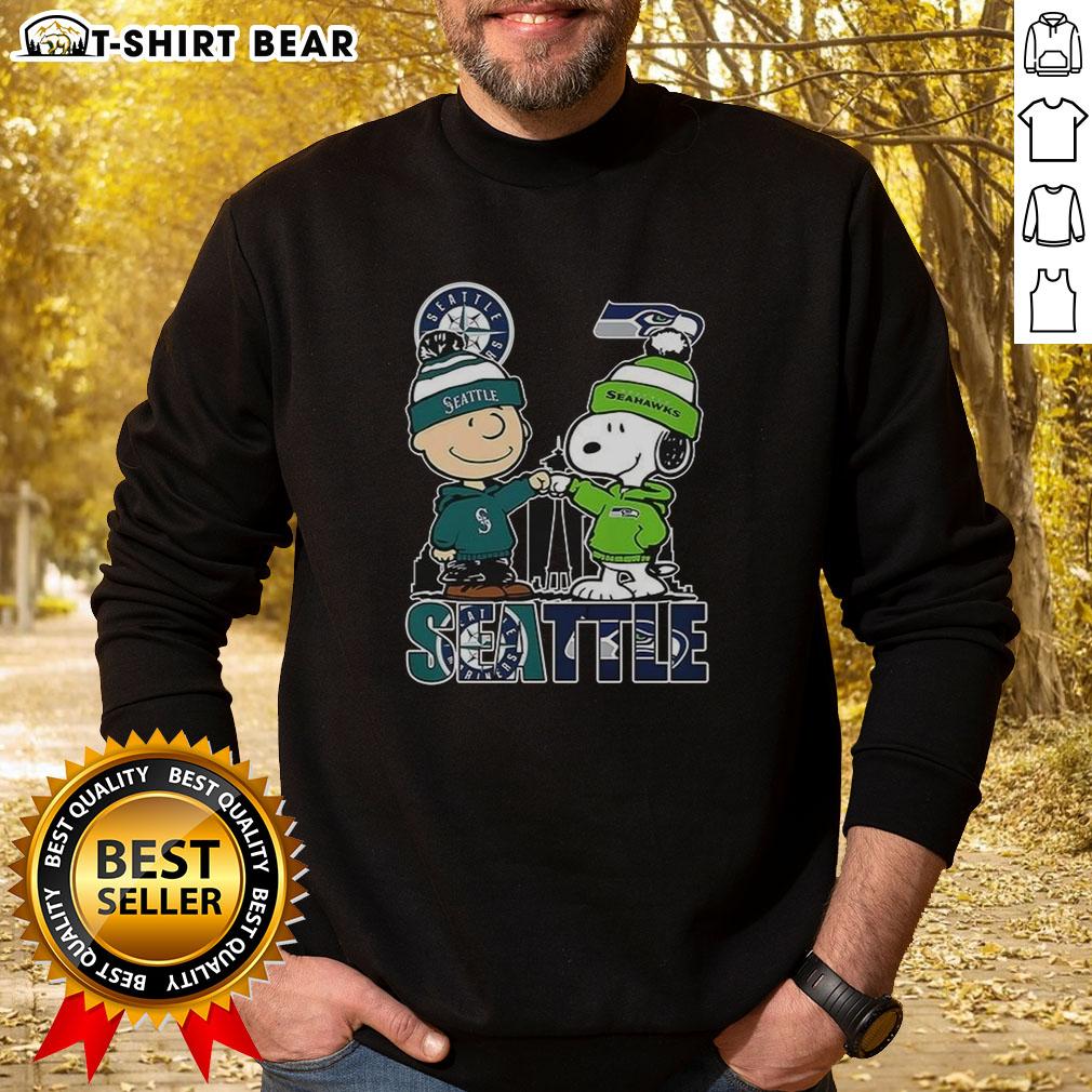 Nice Seattle Washington sweatshirt featuring Charlie Brown and Snoopy with Seattle Seahawks logo, perfect for fans.