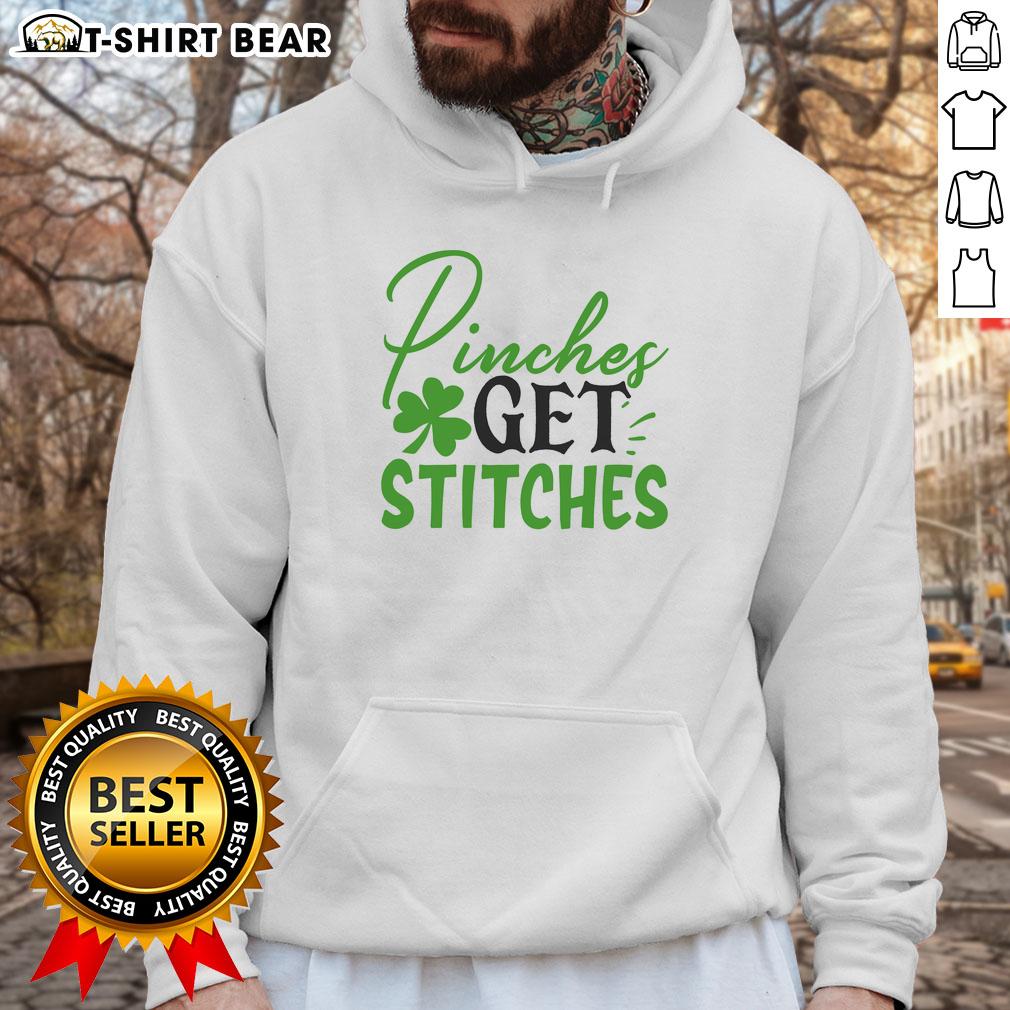 Official Pinches Get Stitches Irish Hoodie featuring a vibrant design perfect for St. Patrick's Day celebrations.