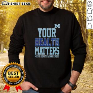 Alt Text: Stylish Pretty Michigan Wolverines sweatshirt with Your Health Matters message, perfect for fans and wellness enthusiasts.
