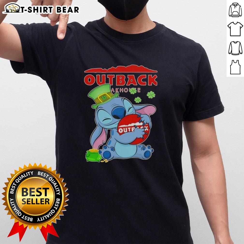 Alt Text: Happy St. Patrick's Day T-shirt featuring Pretty Stitch Hug logo for Outback Steakhouse celebration.
