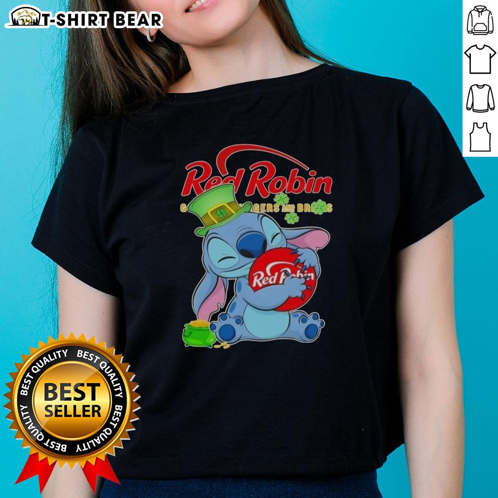 Pretty Stitch Hug the Red Robin logo on a Happy St. Patrick's Day ladies tee, perfect for festive celebrations.
