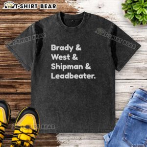 Top Brady and West and Shipman and Leadbeater washed T-shirt displayed on a wooden background showcasing its soft fabric.