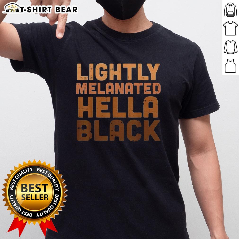 Top Lightly Melanated Hella Black T-Shirt displayed on a wooden background, showcasing vibrant design and comfortable fit.