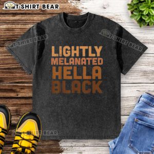Top lightly melanated hella black washed t-shirt on a hanger, showcasing a stylish and trendy casual wear option.