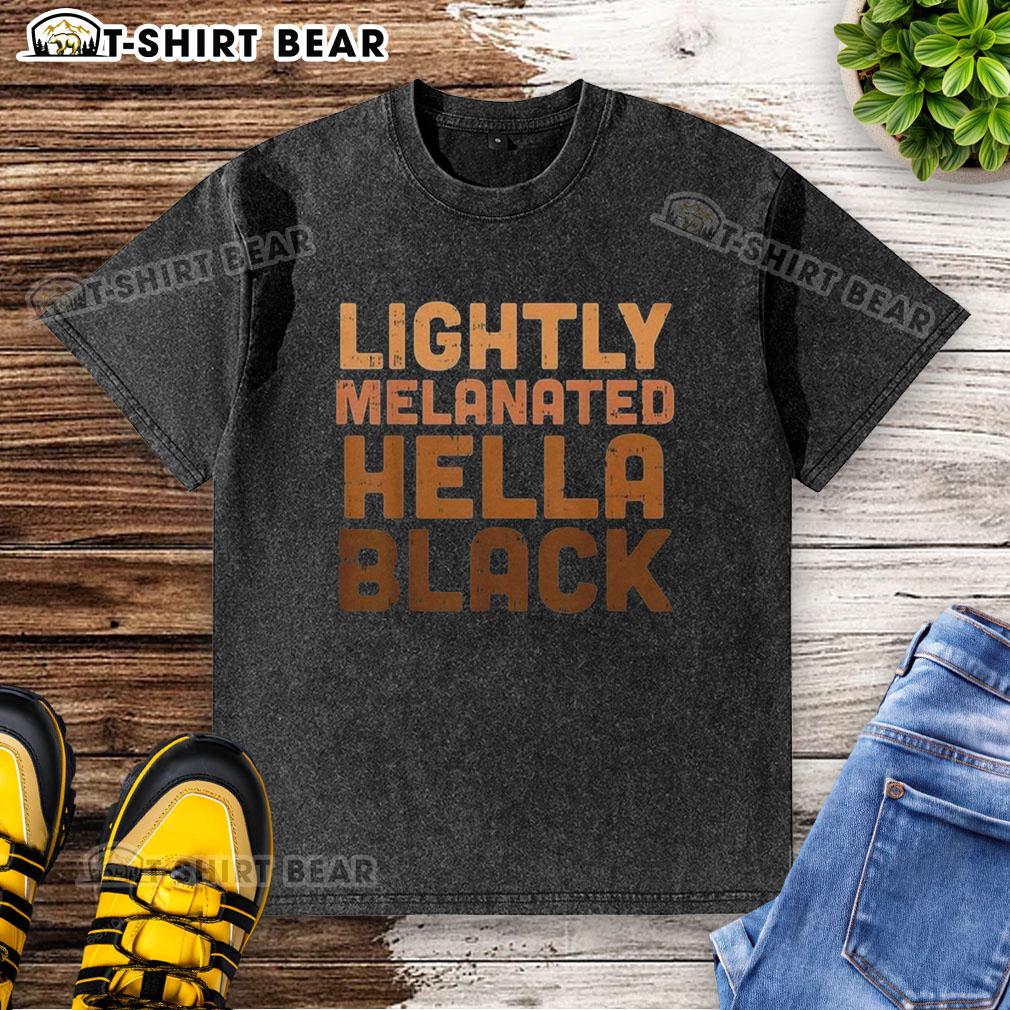 Top lightly melanated hella black washed t-shirt on a hanger, showcasing a stylish and trendy casual wear option.