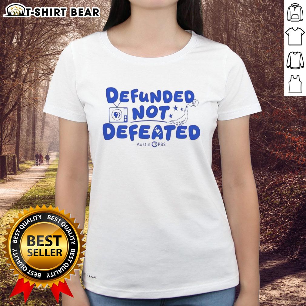 Good Defunded Not Defeated Austin PBS slogan on a stylish ladies tee, promoting support for public broadcasting.