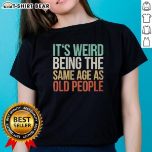 Vintage ladies tee featuring 'It's Weird Being The Same Age As Old People' design, perfect for humorous fashion lovers.