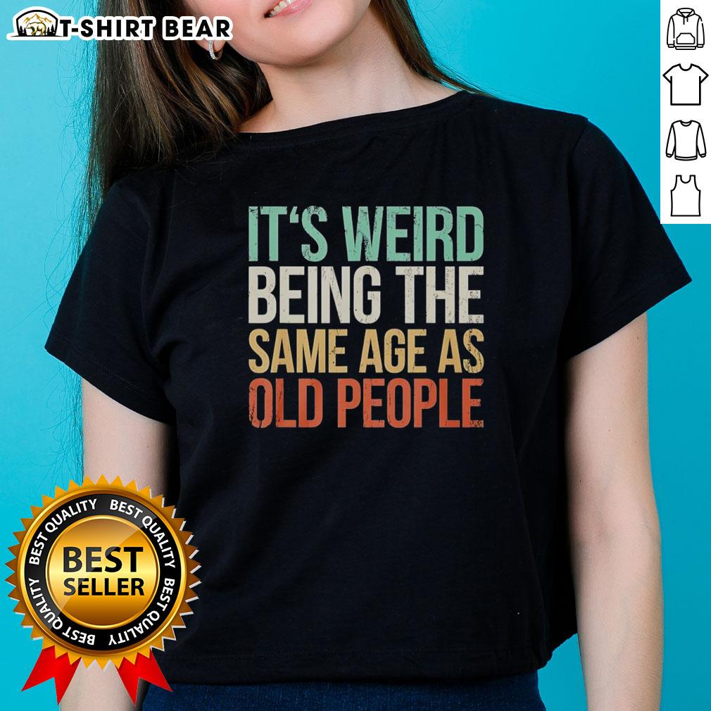 Vintage ladies tee featuring 'It's Weird Being The Same Age As Old People' design, perfect for humorous fashion lovers.