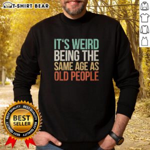 Vintage sweatshirt featuring the phrase It's Weird Being The Same Age As Old People for a quirky, nostalgic style.