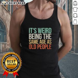 Vintage tank top featuring 'It's Weird Being The Same Age As Old People' design, perfect for nostalgic fashion lovers.